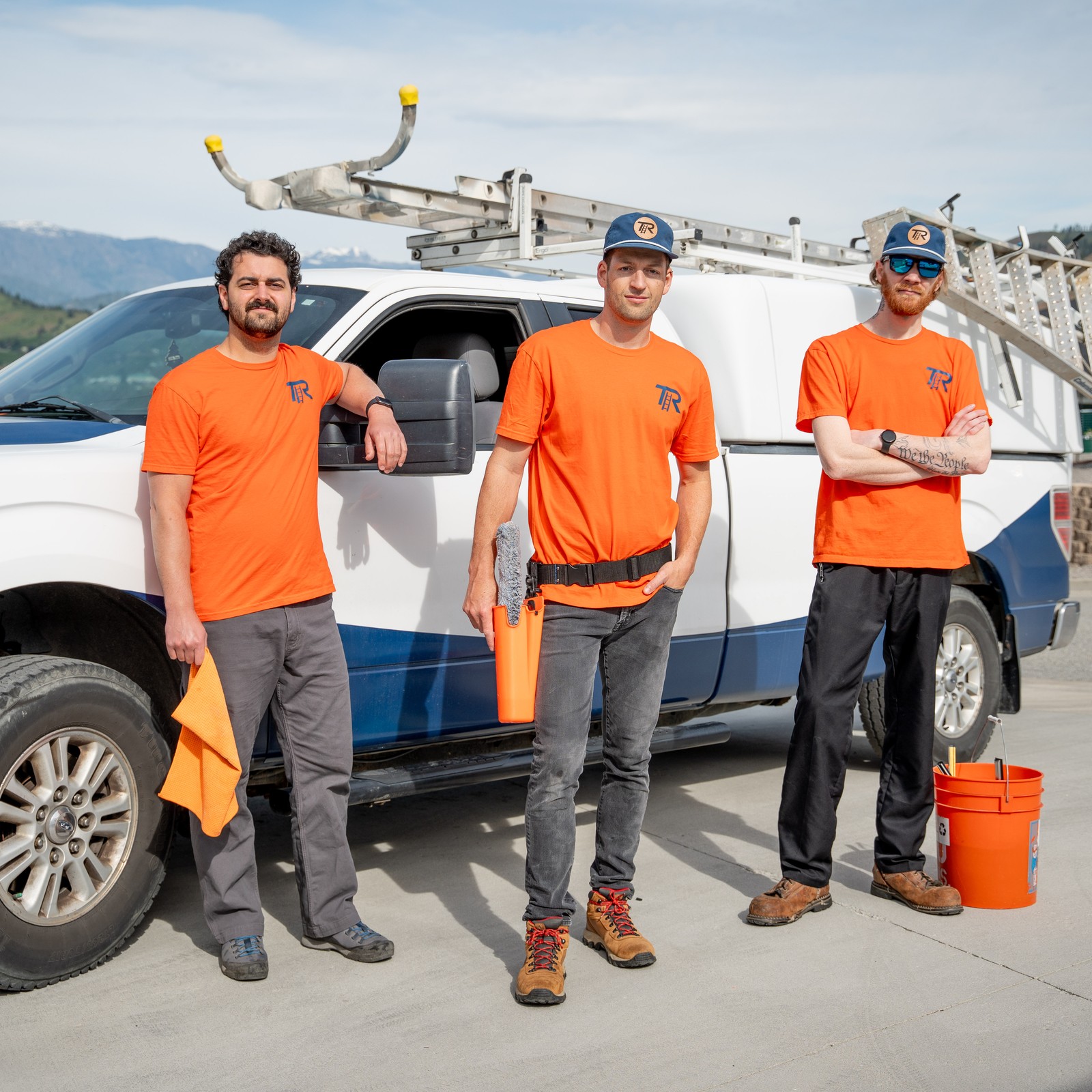 TOPRUNG crew in uniform beside the branded service truck