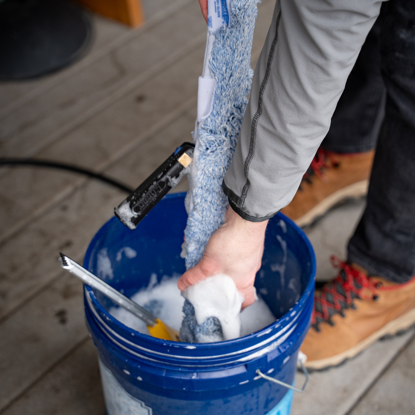 TOPRUNG technician preparing professional window cleaning equipment