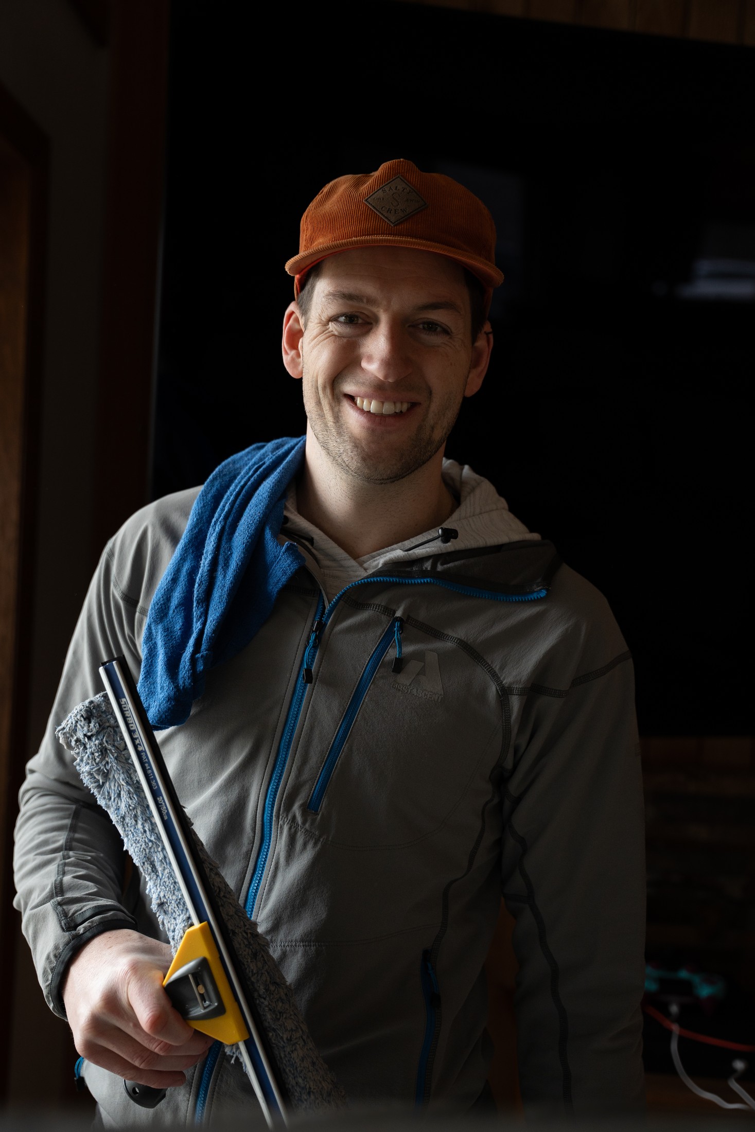 Blake from TOPRUNG holding professional window cleaning tools